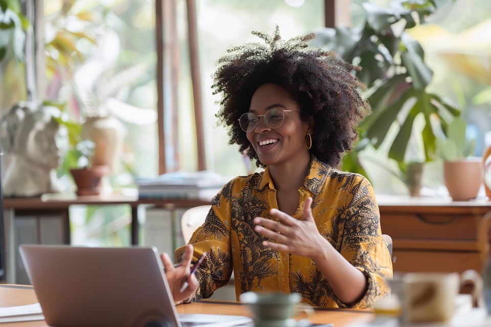 business-woman-discussing-home-insurance-options-virtual-meeting-laptop-setup-bright-home-office